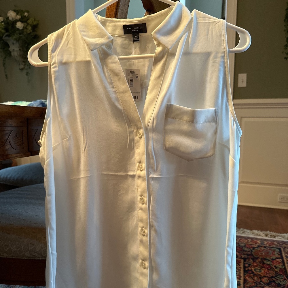 Off white sleeveless blouse